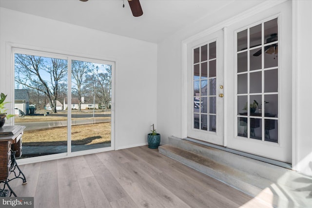 sunroom with ceiling fan and french doors