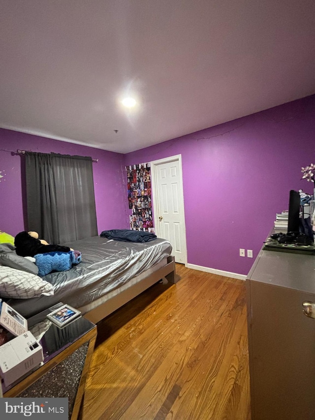 bedroom featuring hardwood / wood-style floors