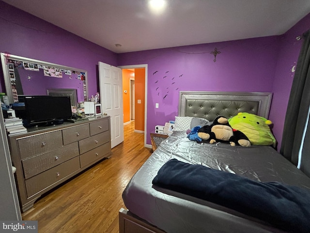 bedroom with light wood-type flooring