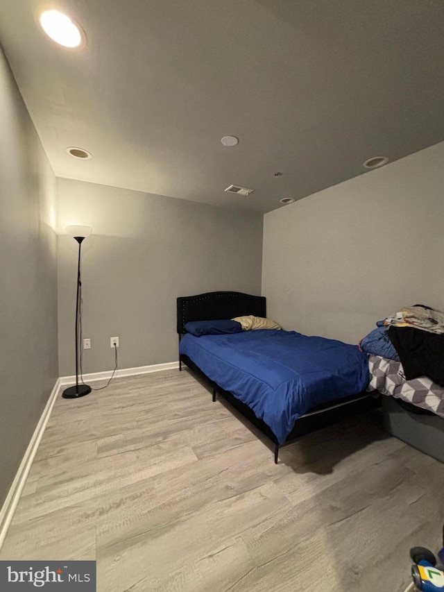 bedroom with light hardwood / wood-style floors