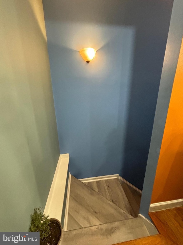 stairway featuring hardwood / wood-style floors