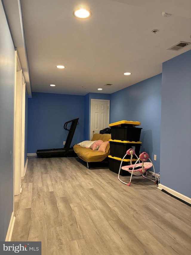 bedroom with light hardwood / wood-style floors