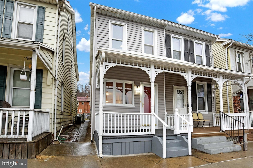 multi unit property with covered porch and central AC unit