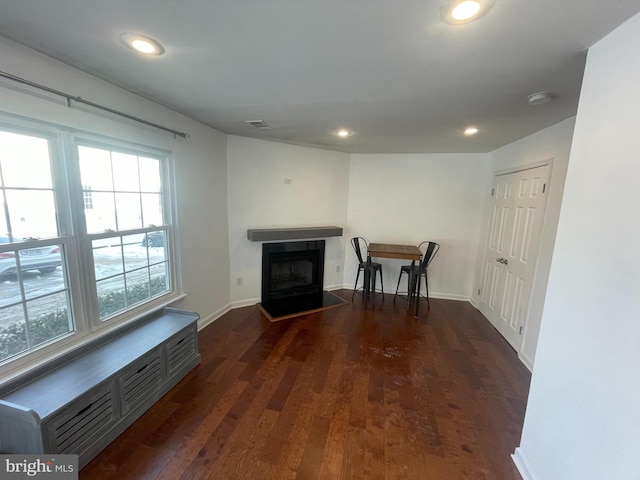 unfurnished living room with dark hardwood / wood-style floors