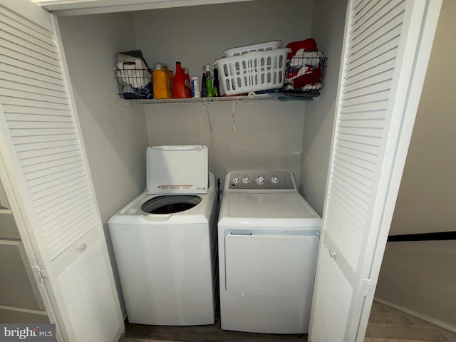 clothes washing area featuring washer and clothes dryer