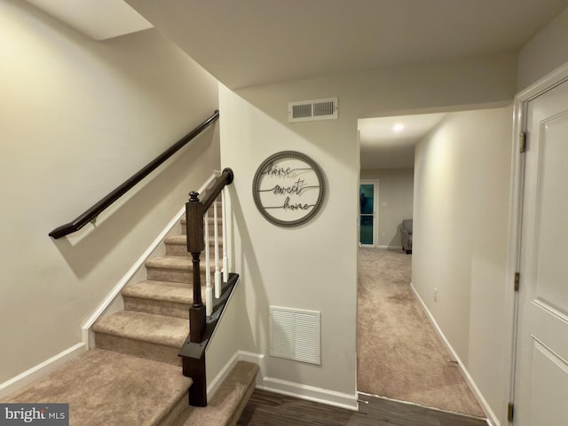 staircase with carpet