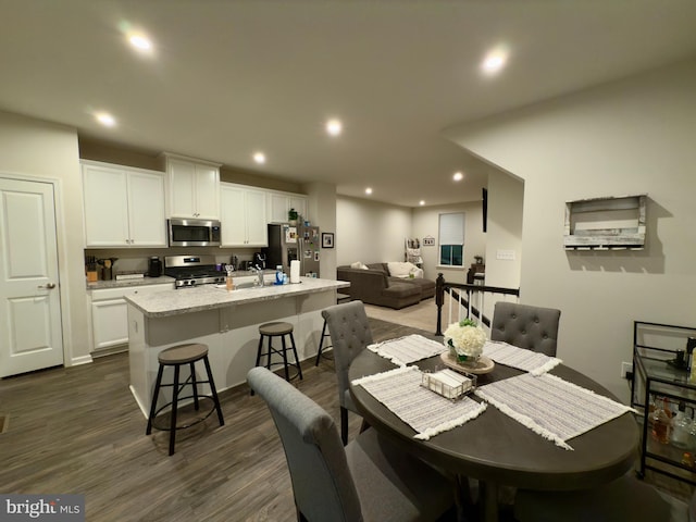 dining space featuring dark wood-type flooring