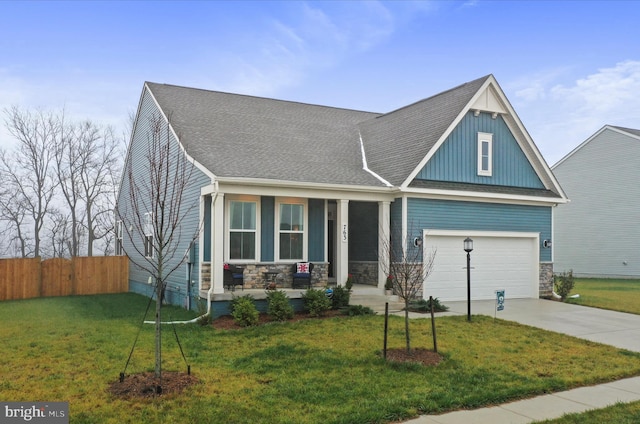 craftsman house featuring a front lawn, a porch, and a garage