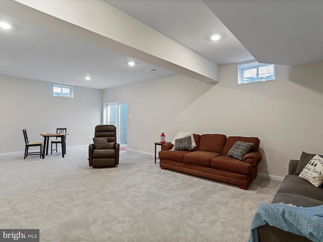 living room with a healthy amount of sunlight and light carpet