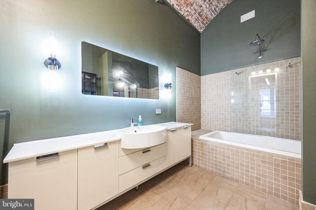 bathroom with vanity, tile patterned flooring, and plus walk in shower