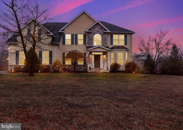 colonial house featuring a yard