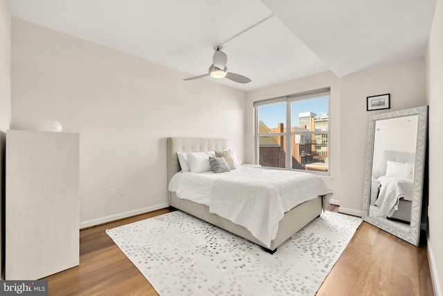 bedroom with ceiling fan and hardwood / wood-style floors