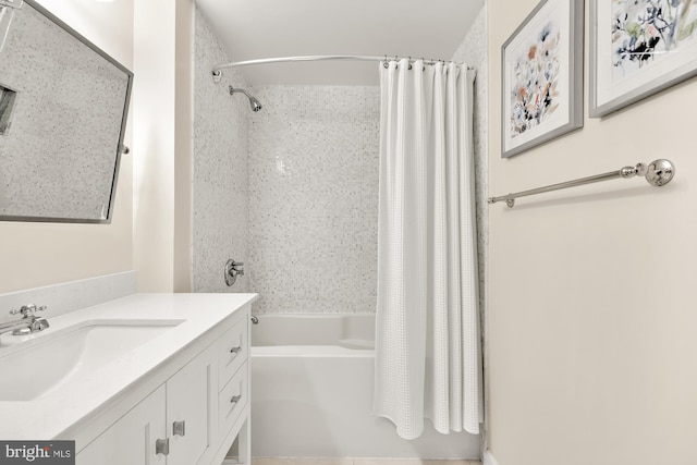 bathroom featuring vanity and shower / tub combo with curtain