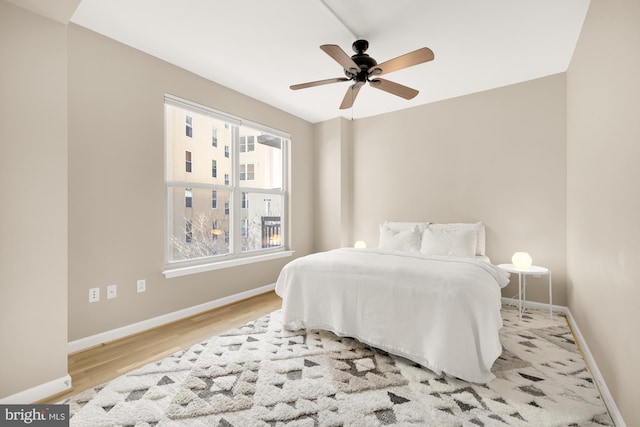 bedroom featuring ceiling fan and light hardwood / wood-style floors