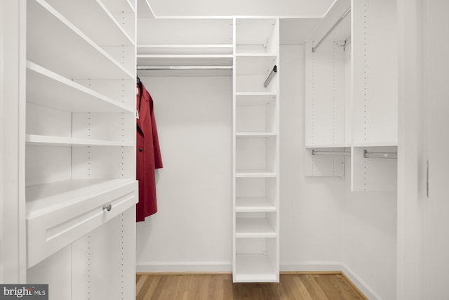 walk in closet featuring hardwood / wood-style floors