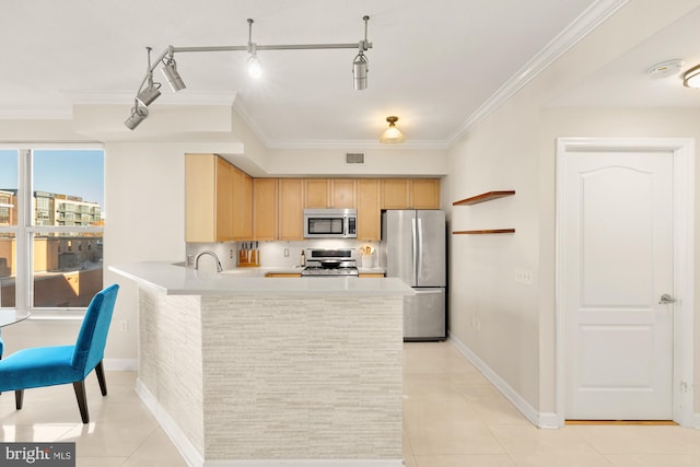 kitchen featuring kitchen peninsula, appliances with stainless steel finishes, light brown cabinetry, track lighting, and light tile patterned flooring