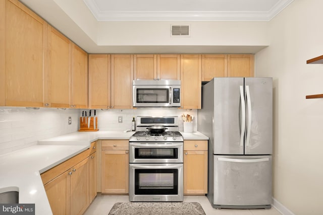 kitchen with appliances with stainless steel finishes, backsplash, and light brown cabinetry