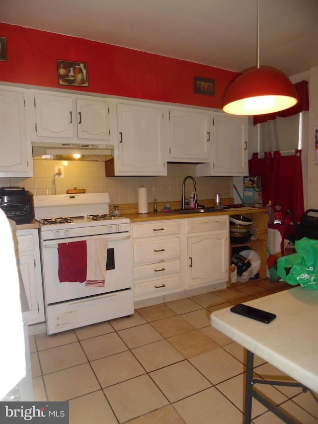 kitchen featuring backsplash, white cabinetry, sink, and white range with gas cooktop