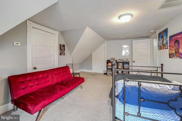 carpeted bedroom featuring vaulted ceiling