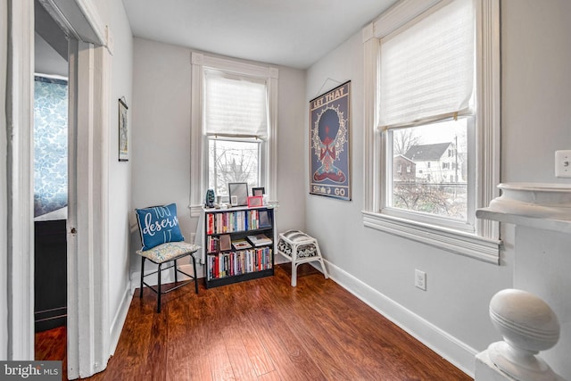 sitting room with dark hardwood / wood-style flooring