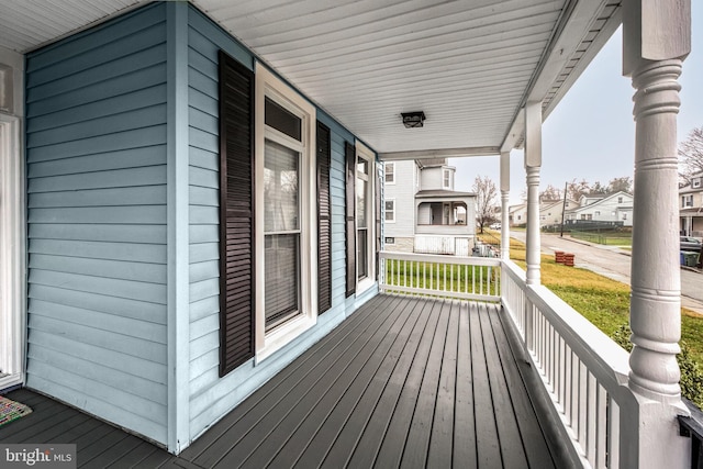 wooden terrace featuring a porch