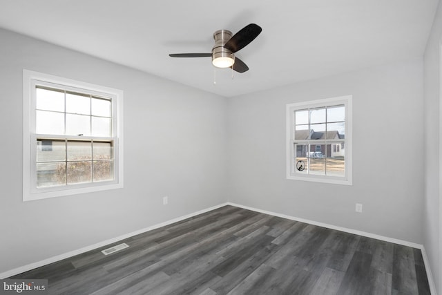 unfurnished room featuring ceiling fan and dark hardwood / wood-style floors