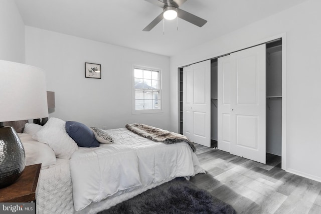 bedroom with hardwood / wood-style floors and ceiling fan