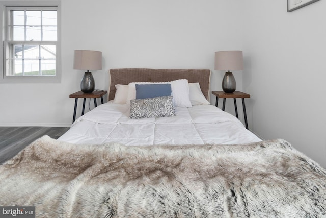 bedroom with hardwood / wood-style flooring