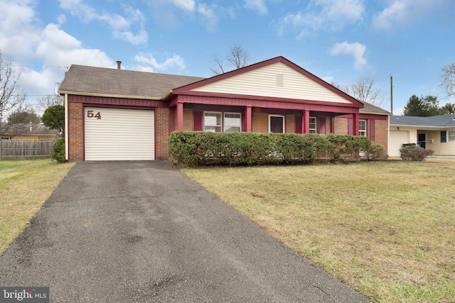 ranch-style house with a garage and a front lawn