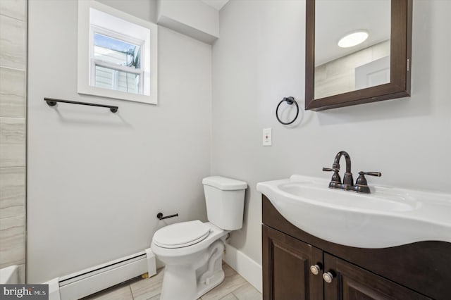 bathroom with vanity, toilet, and baseboard heating