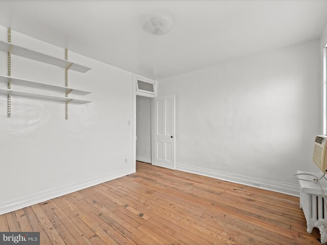 spare room with light hardwood / wood-style floors