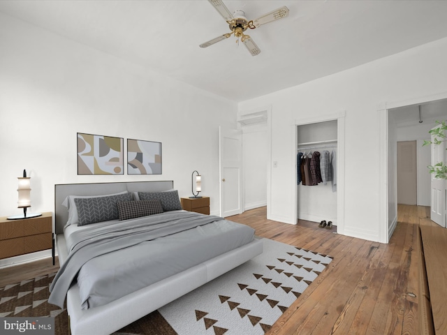 bedroom featuring hardwood / wood-style floors, a closet, and ceiling fan