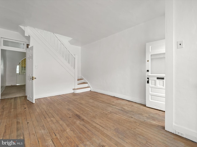 unfurnished living room with light wood-type flooring