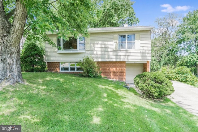 exterior space featuring a garage and a front lawn