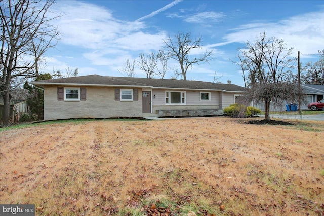 ranch-style home with a front yard