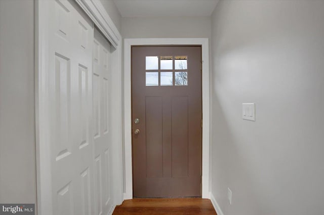 doorway with dark hardwood / wood-style floors