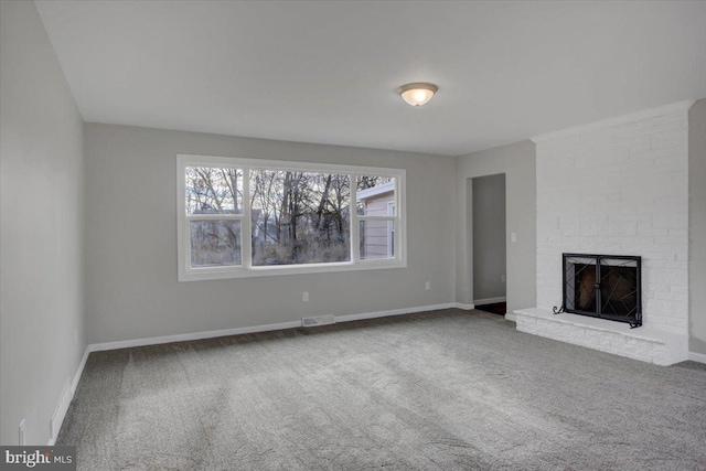 unfurnished living room featuring a fireplace and carpet floors