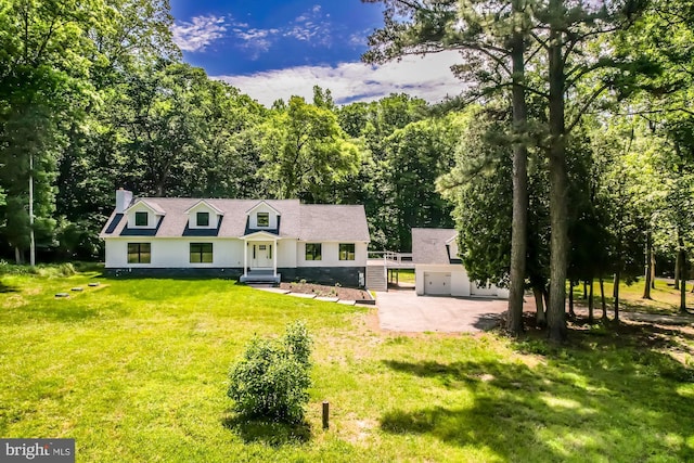 cape cod home with a front lawn