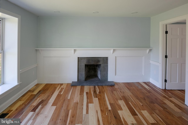 unfurnished living room with light hardwood / wood-style flooring