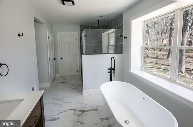 bathroom featuring vanity and shower with separate bathtub