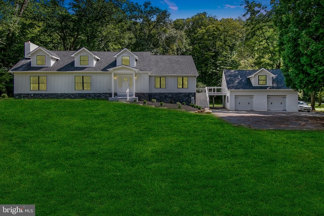 cape cod house featuring a front lawn