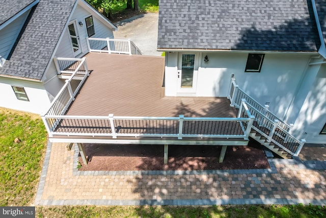 back of property with a deck