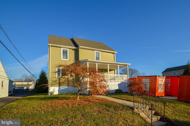 view of front of house featuring a front lawn and a porch