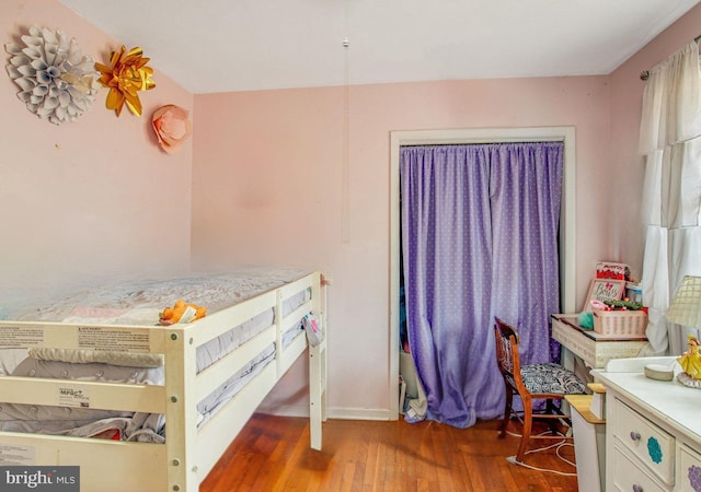 bedroom featuring wood-type flooring