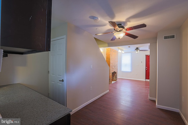 hallway with dark hardwood / wood-style flooring