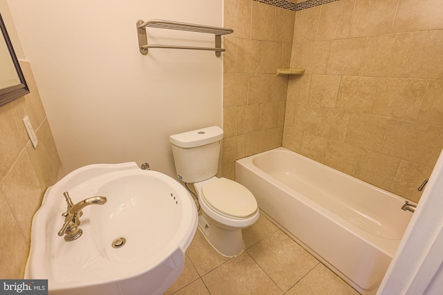 full bathroom with sink, toilet, tile patterned flooring, and bathing tub / shower combination