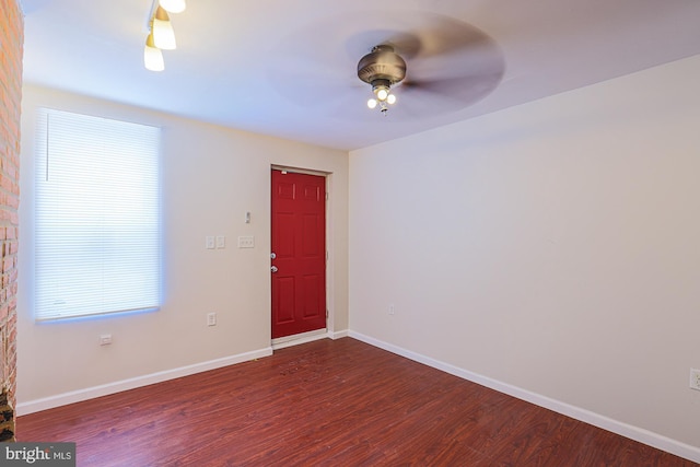 empty room with hardwood / wood-style floors and ceiling fan