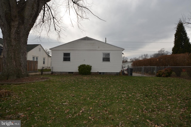 view of home's exterior with a lawn