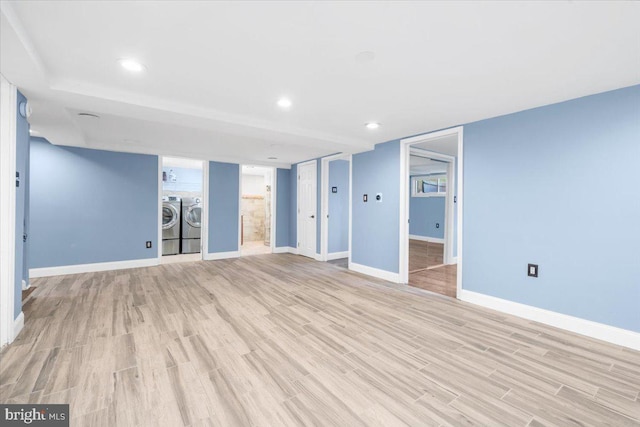 interior space with light hardwood / wood-style flooring and washer and clothes dryer