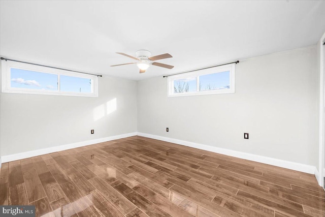 empty room featuring ceiling fan and wood-type flooring